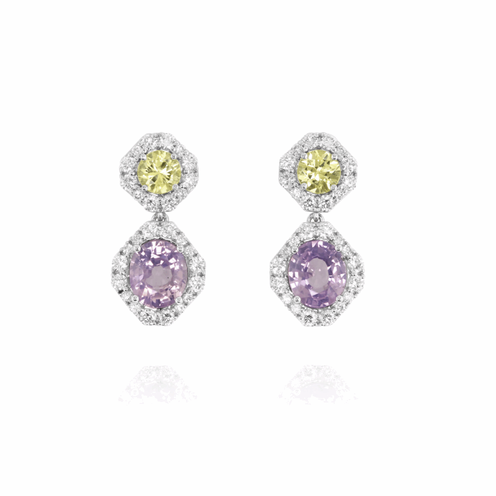 A pair of dangle earrings featuring round yellow gemstones on top and larger oval lavender gemstones below, each framed with white diamond halos in a geometric setting.